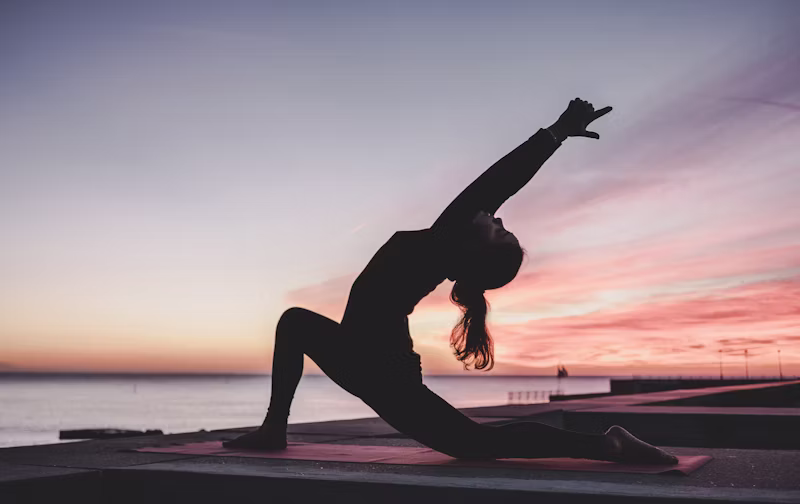 Person practicing morning stretching routine