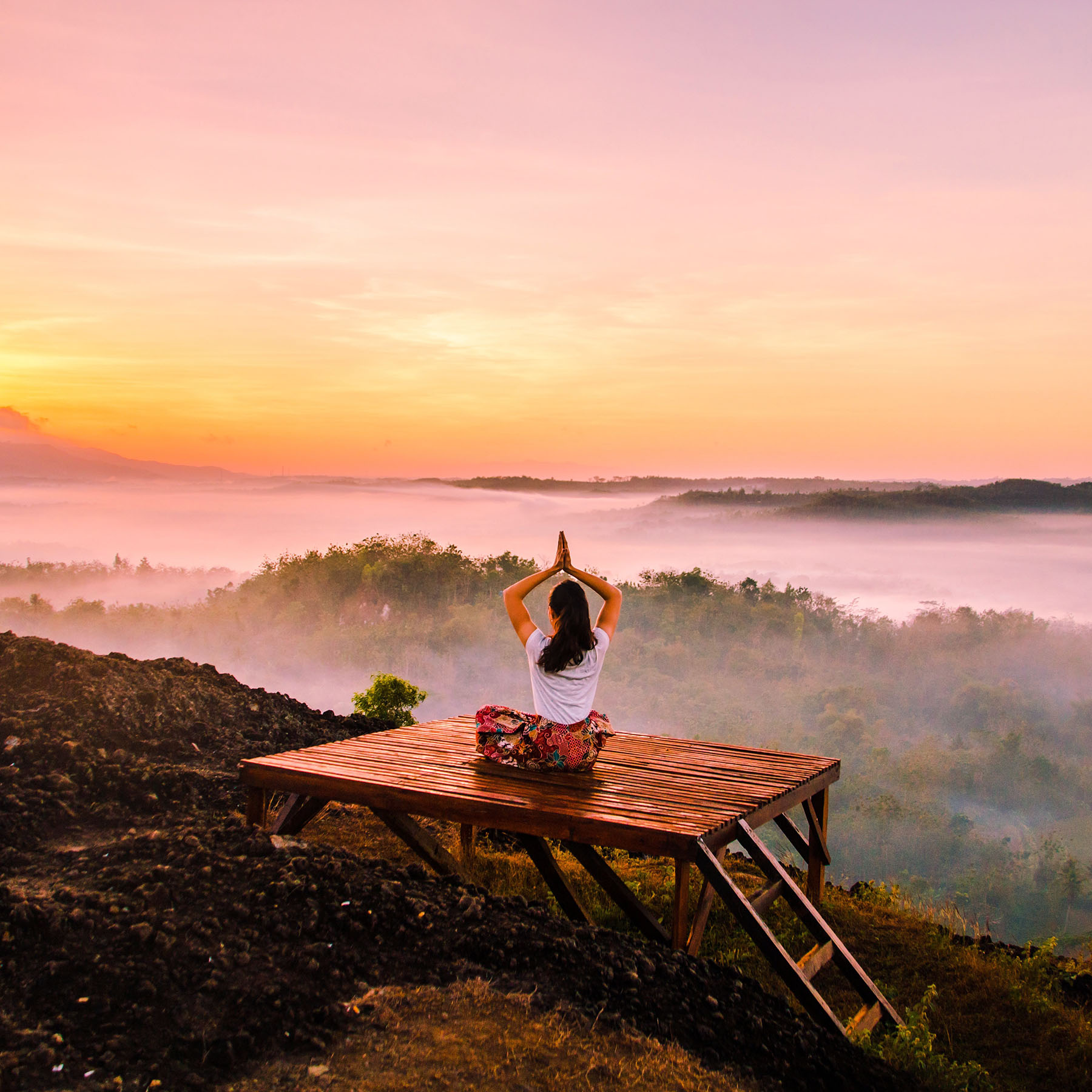 Person doing morning yoga and flexibility exercises